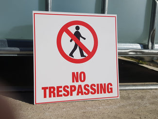 SIGN: NO TRESPASSING